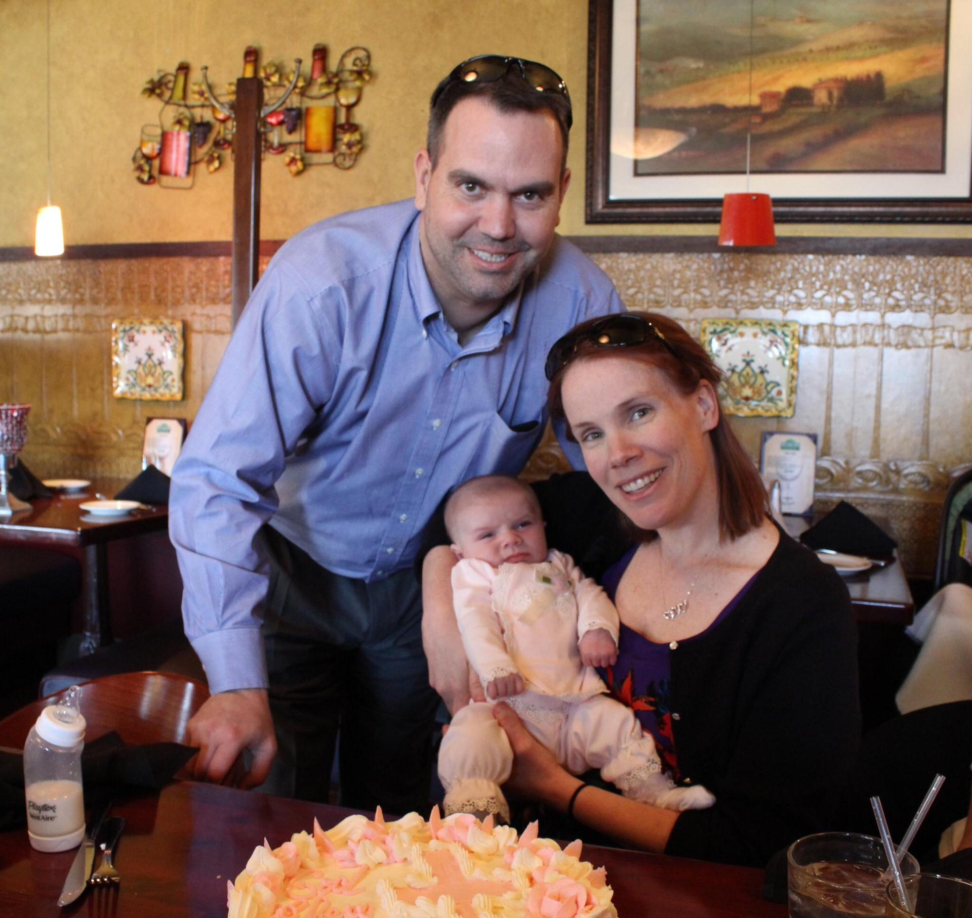Steve, Alexis and Baby Samantha at a restaurant 