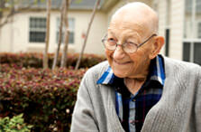 Smiling elderly man outdoors