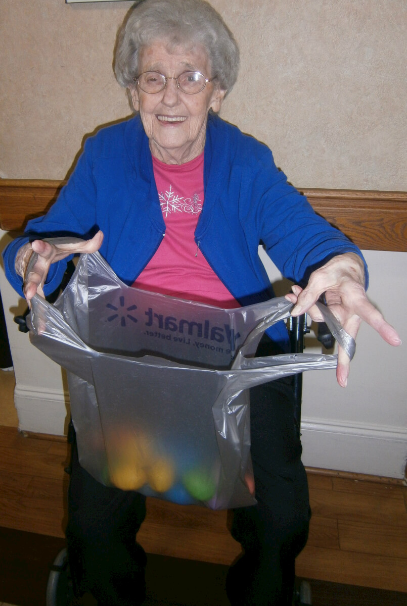 DePaul's Wexford House resident Sammie Atwell shows off her haul in the Easter egg hunt.