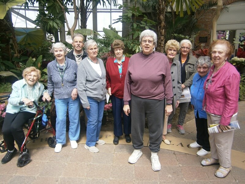 Group photo of DePaul Glenwell residents at the Buffalo Botanical Gardens