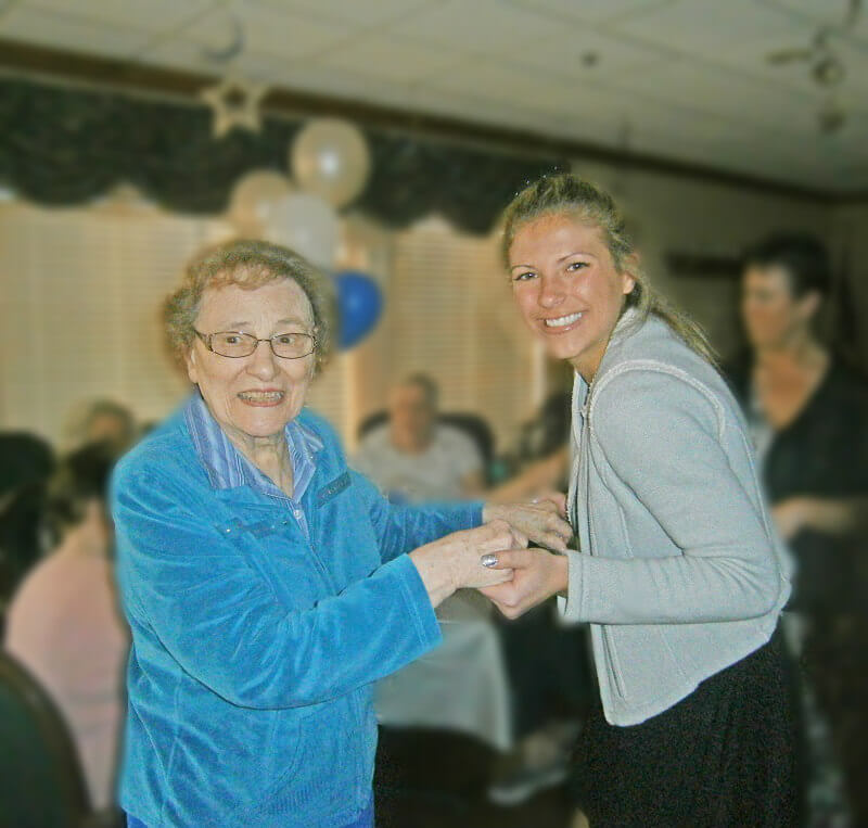 Horizons resident Betty Hoffman shares a dance with Key Club member Kathleen Wantuck