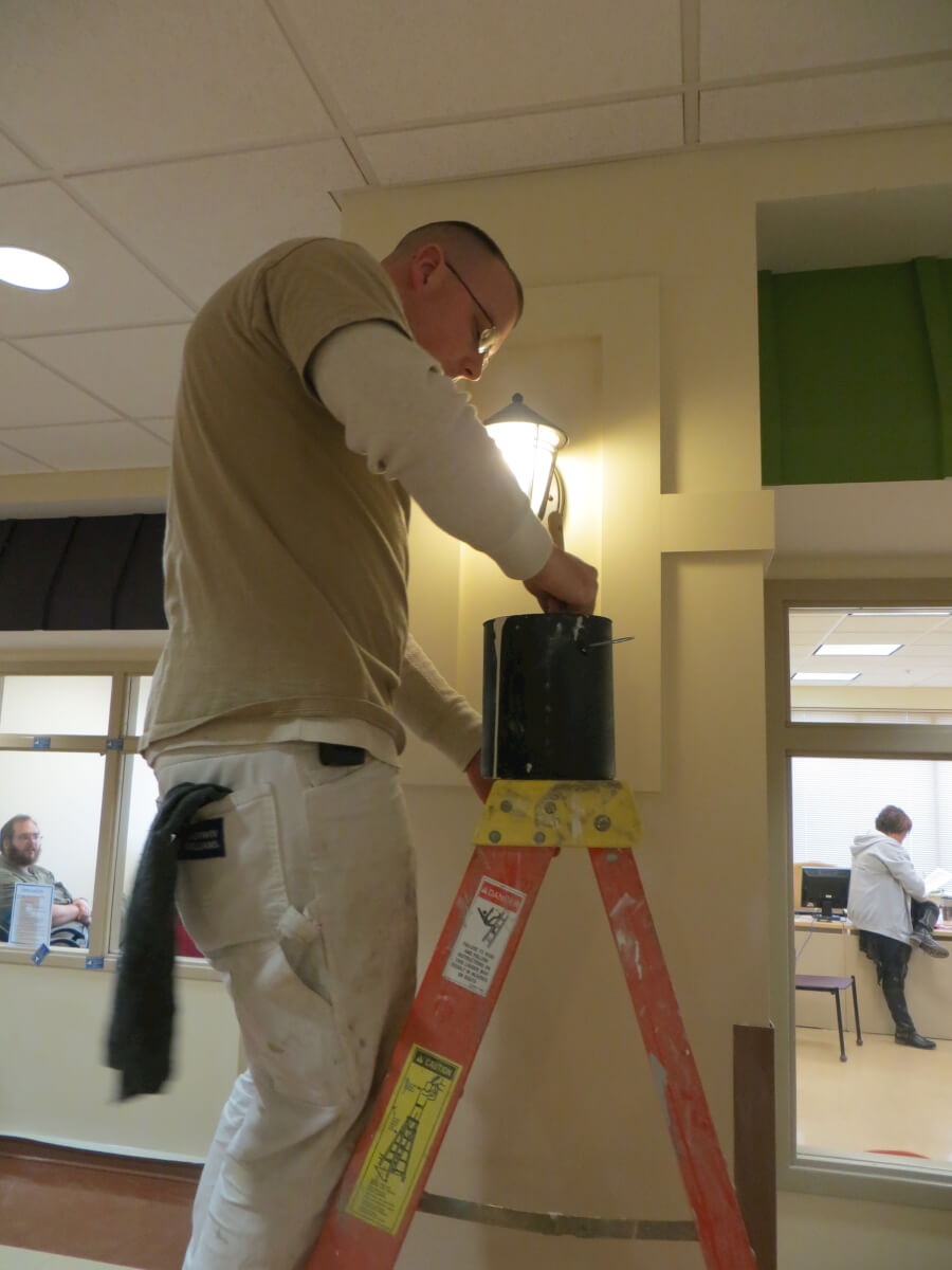  Apprentices with the International Union Painters and Allied Trades Dan Martin and Will Stacy painting DePaul's City Center