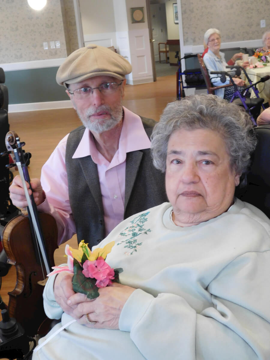 Westwood Commons resident Lucille Connell with violinist Lynn Arnold