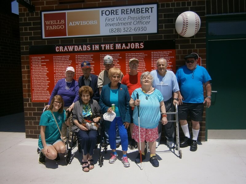 Wexford House assisted living residents and employees group photo outside the stadium