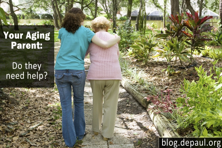 Photo of a young woman helping an older woman walk 