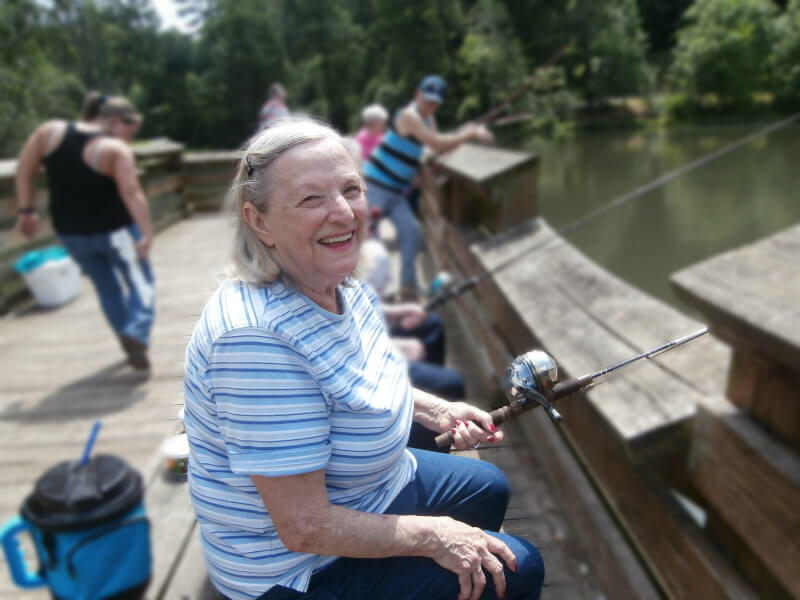 DePaul resident Eva Briggs waiting patiently for a bite at the fishing hole