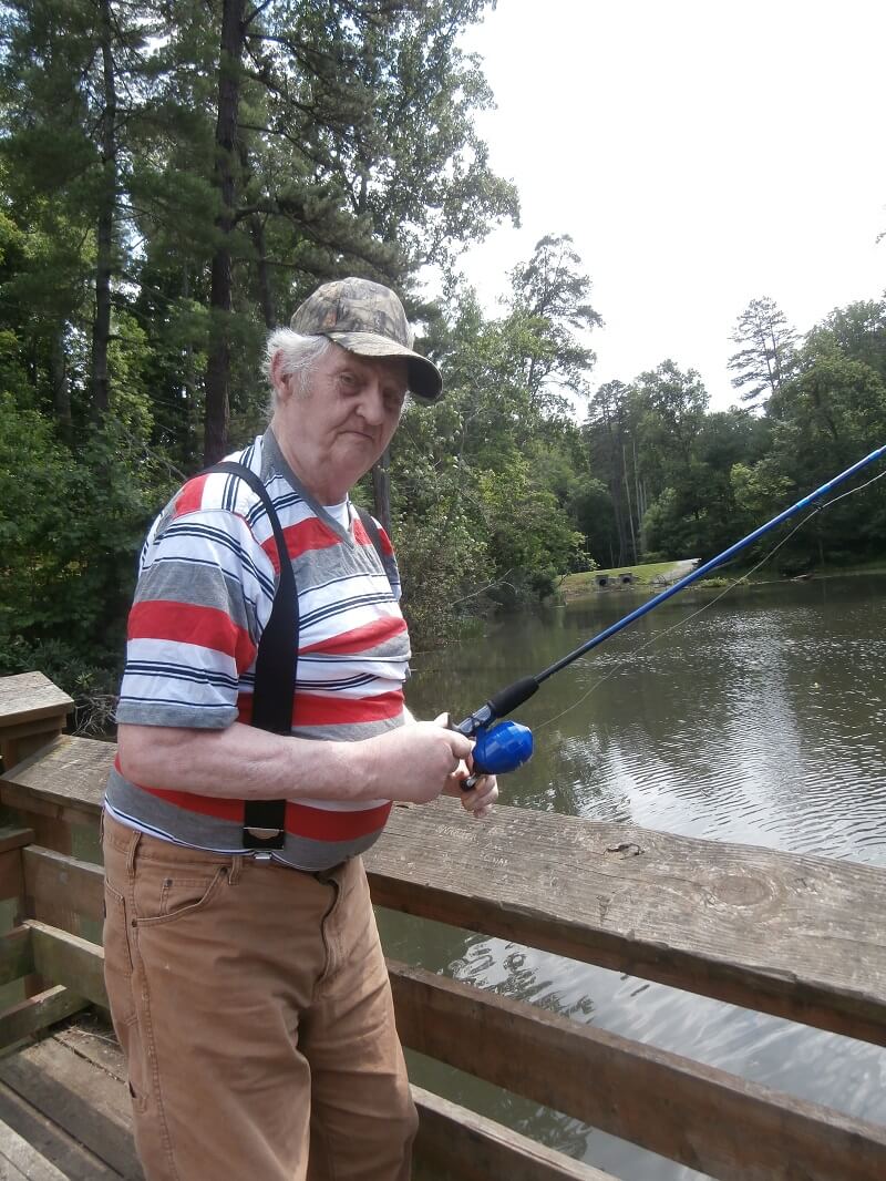 Twelve Oaks resident Herman Trivett casting his line into the water