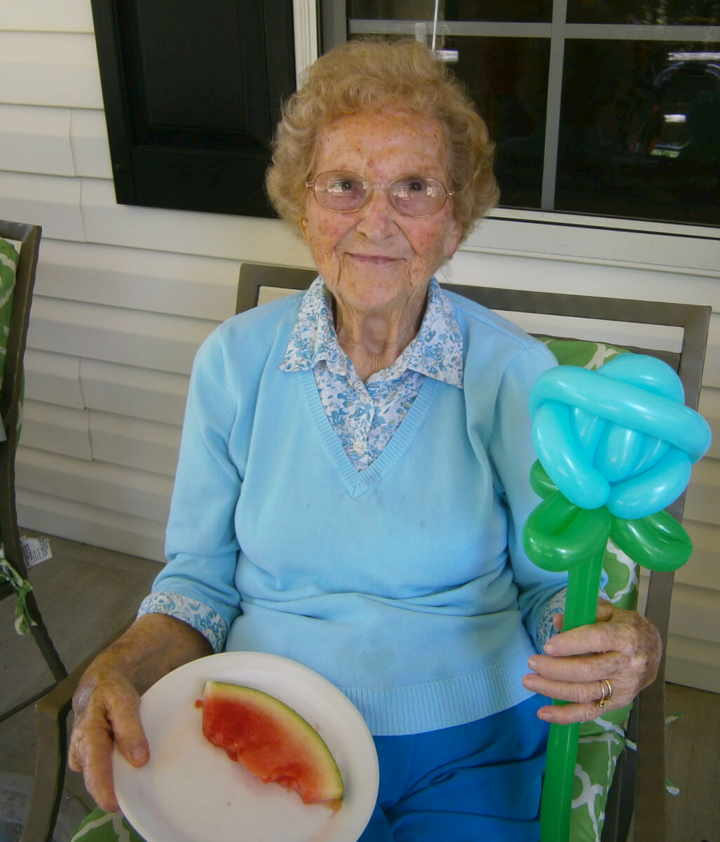 Cambridge House resident Joie Dayberry  with her watermelon and balloon flower