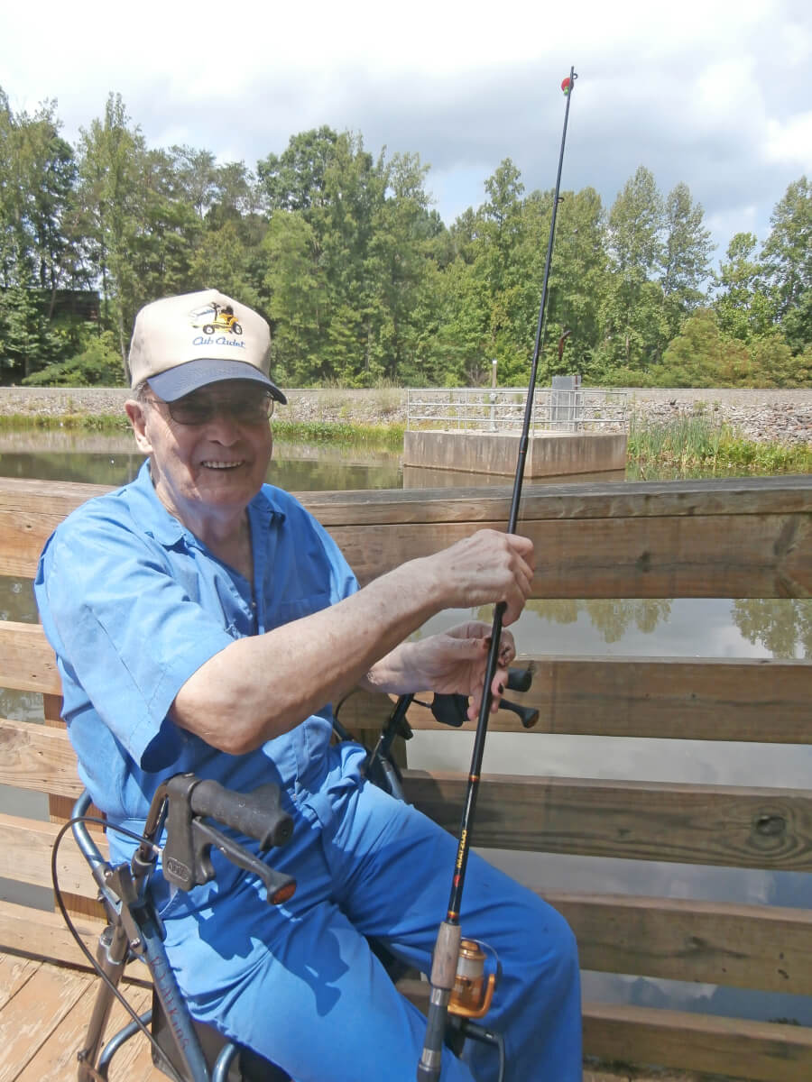 Twelve Oaks resident RJ Atkins casting his line into the fishing pond at Westwood Park 