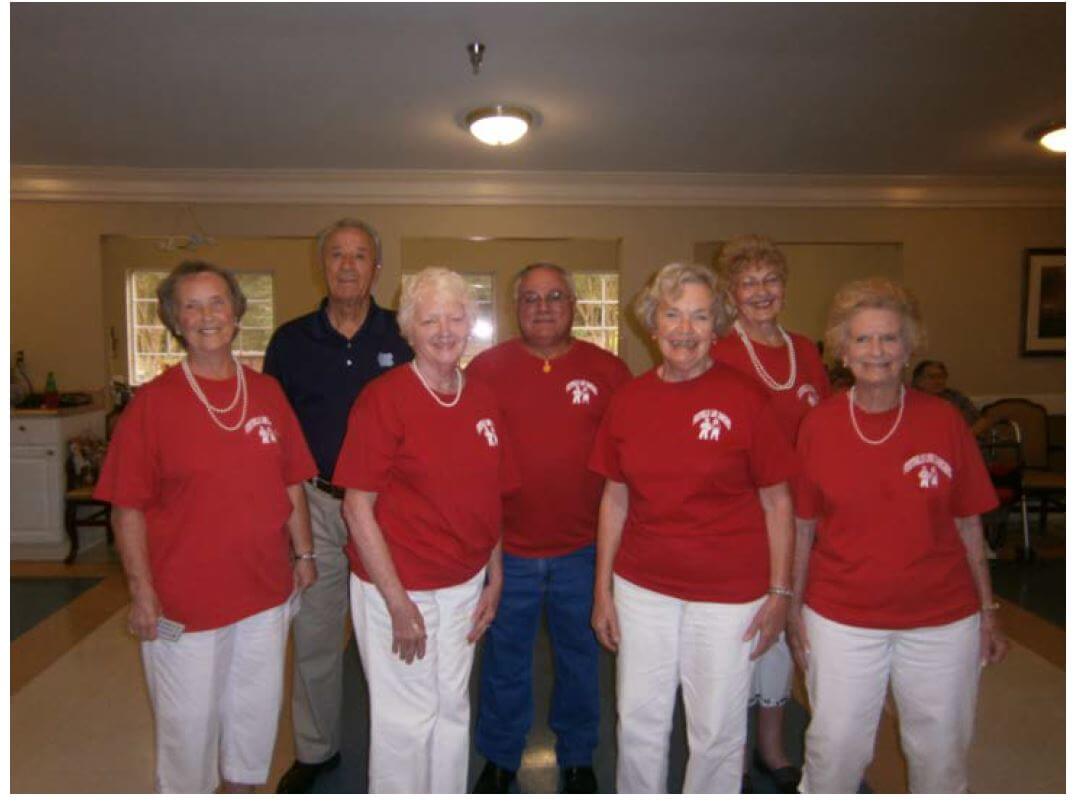 the Foothills Line Dancers pose for a photo at Cambridge House