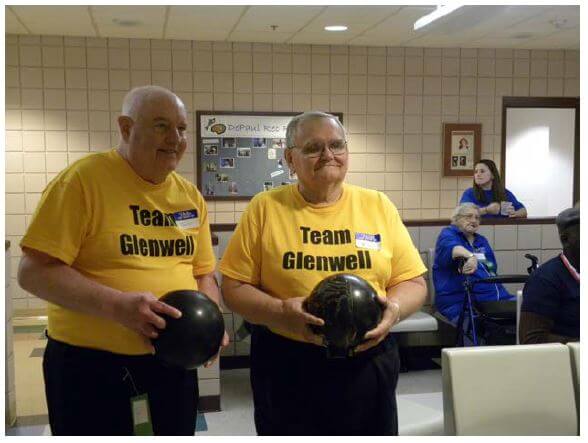 Glenwell residents Earl 'Curly' Mayer and Bill Casey warm up for bowling in DePaul’s Senior Olympics.