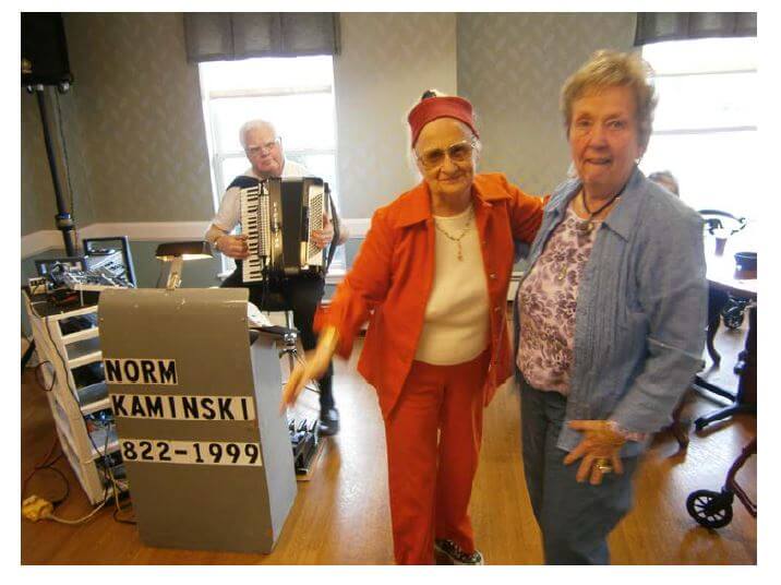 Glenwell residents dancing to Norm Kaminski providing polkas, upbeat and traditional melodies 