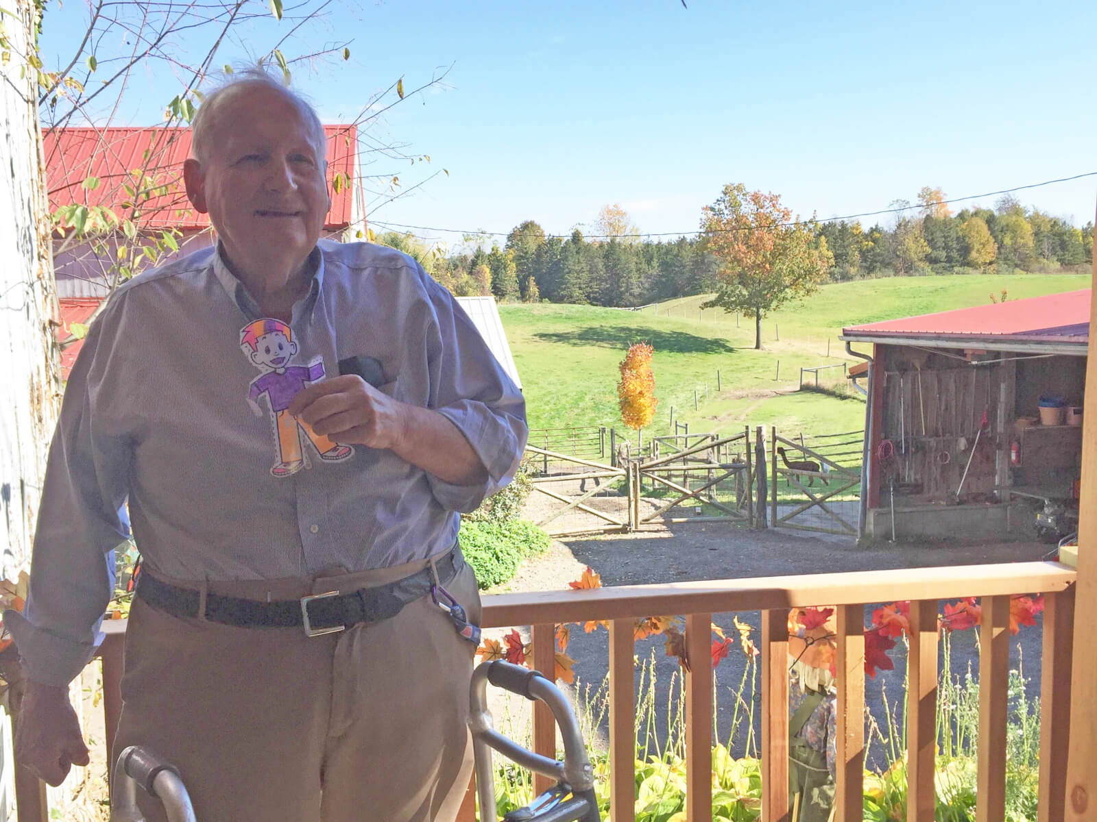 Woodcrest Commons resident John Hicks holding Flat Stanley 