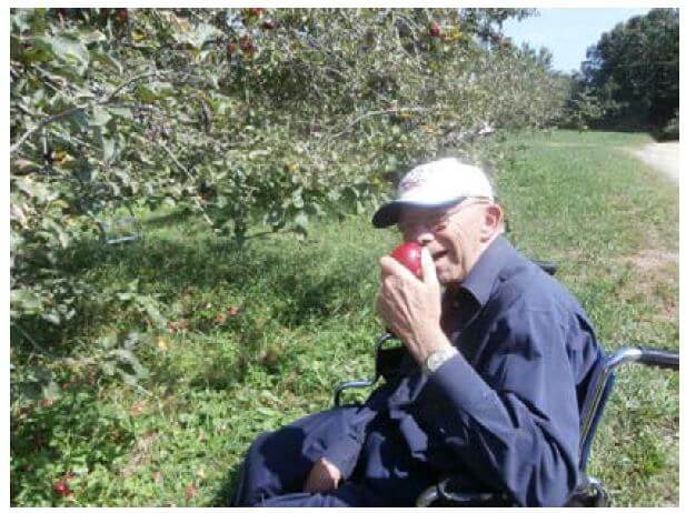 Twelve Oaks resident Jim Moore eating an apple