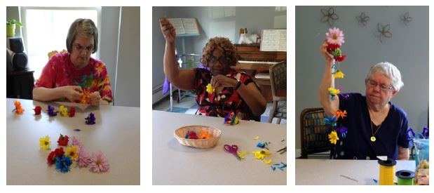 Woodcrest Commons residents making Hawaiian Leis 