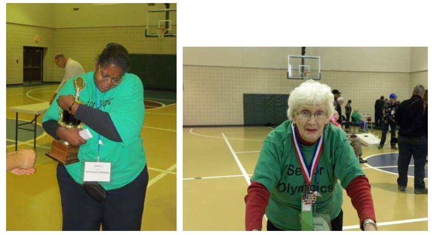 Westwood Commons Activities Director Cathy Toney hands over trophy and resident plays shuffleboard 