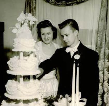 Marion and Jim Schmeer cutting their wedding cake in 1947