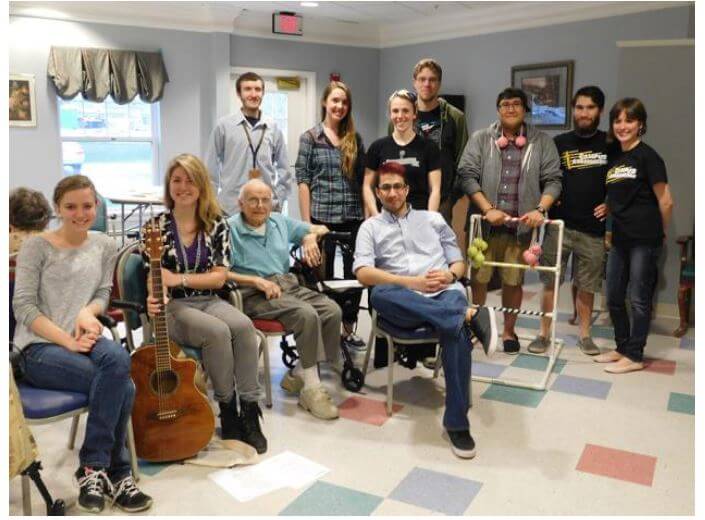 Christian students posing for a photo with Westwood Commons residents