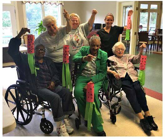 Woodridge residents Wortha Jackson, Jacquelyn Massey, Chloe Phillips, Nancy Snyder, Gloria King, and Activities Director Brittany Plyler with their watermelon crafts