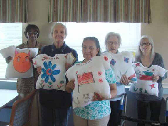 Greenbrier residents Inez Allen, Lula Denny, Barbara Lowery, Lee Ann Sproul and Sherri Hunt show off pillow shirts they made this summer.