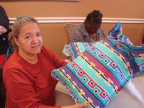 Greenbrier residents Barbara Lowery and Lillie Bryant sew bed pillows