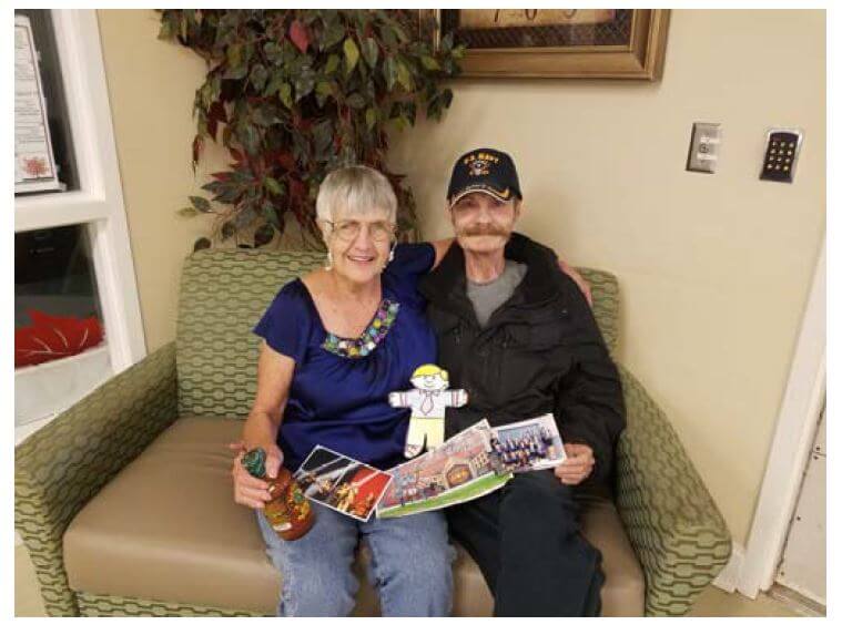 Hickory Village couple with their flat stanley travel mementos 