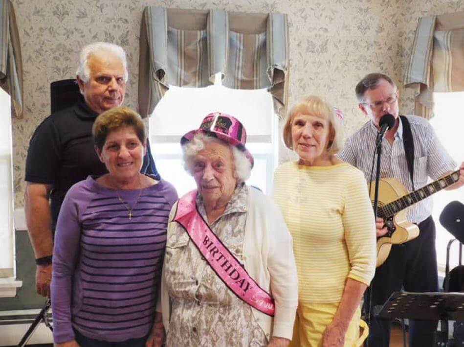 Westwood Commons resident Adelaide Swetz and her family celebrating her 100th birthday