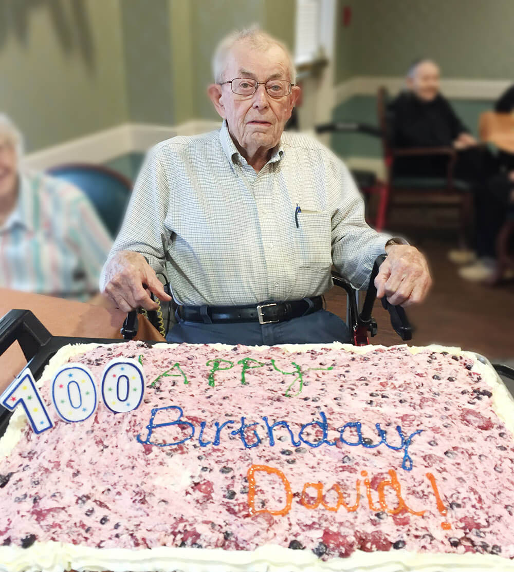 Woodcrest Commons resident David Gerhardt with his 100th birthday cake