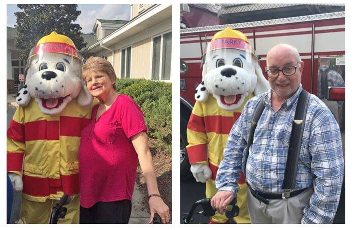  Monroe Fire Department’s mascot Sparky are Woodridge residents Libby Hess and Eddie Craig