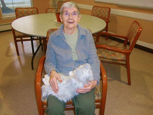 Glenwell resident Lois Calos with Joy For All Cat made by Hasbro