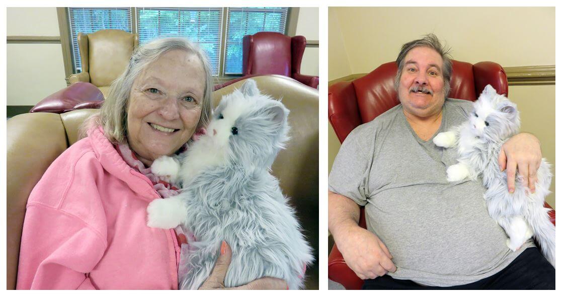 Twelve Oaks residents holding and cuddling with the Hasbro Joy for All companion cat