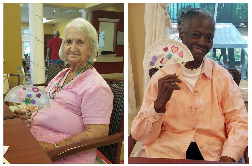 Woodridge residents Kathryn Stilwell and Patricia Coffey with their decorative hand fans
