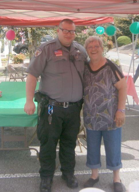 Heath House resident Phyllis Spence is pictured with a local Sheriff’s deputy