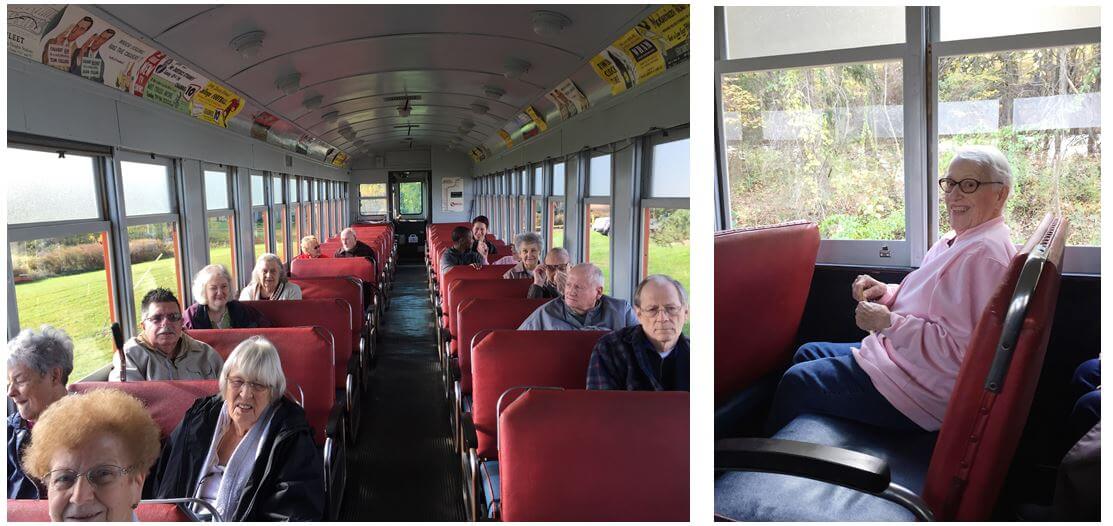 Woodcrest Commons residents on a vintage trolley decorated in historic ads