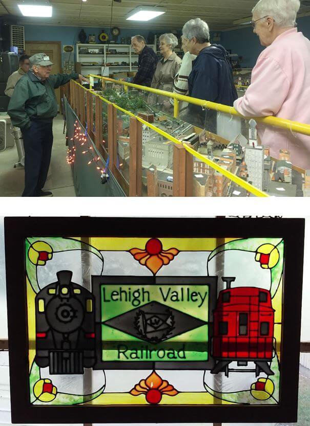 Woodcrest Commons residents Doug Kurlan, Richard Marsh, Lois Knapp and Norene Hogan ask a volunteer questions about the model train exhibit at the New York State Museum of Transportation in Rush