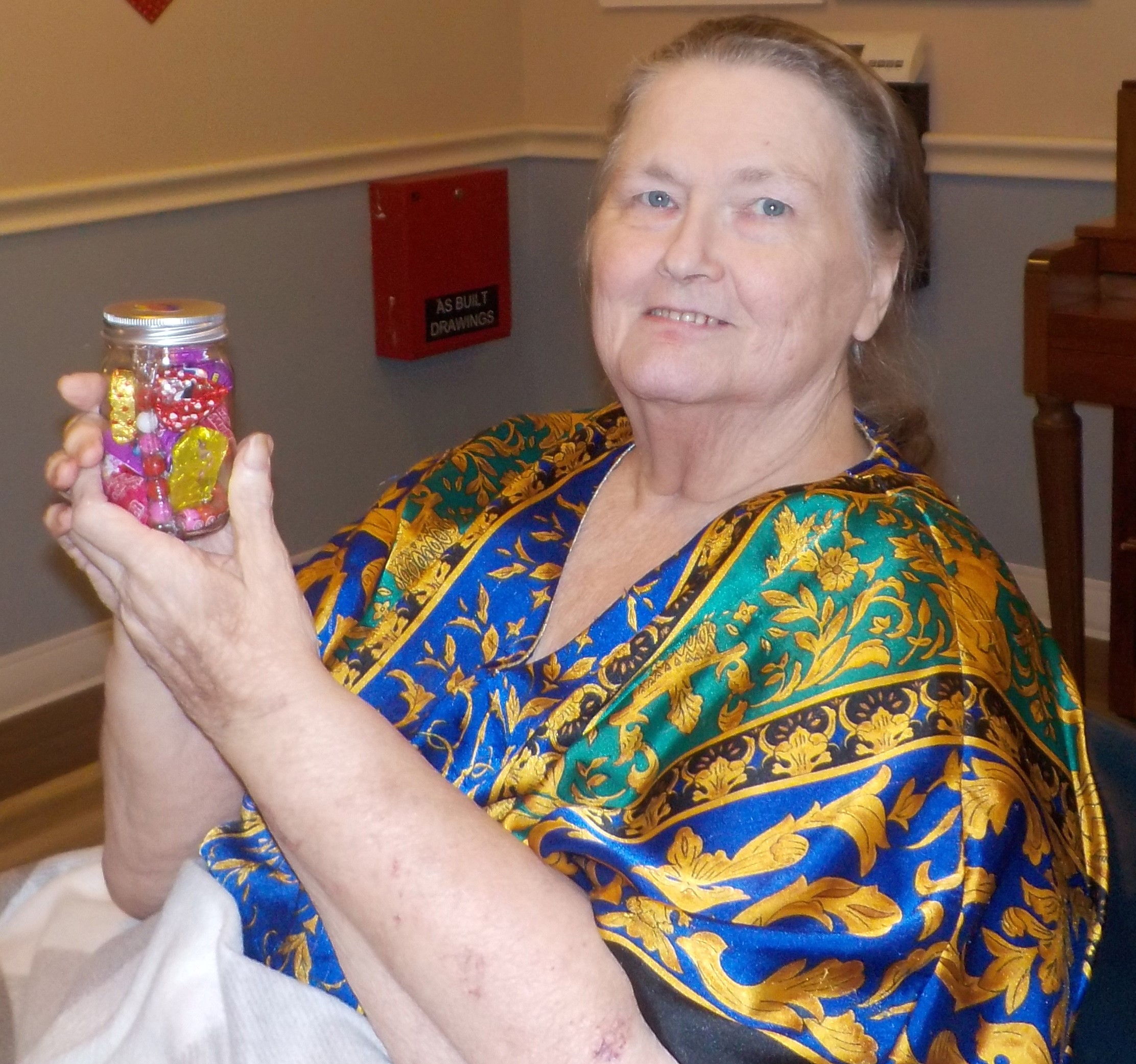 Norma Barton shows off a jar of candy she won in a raffle.