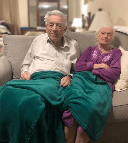 Elderly couple sitting on the couch