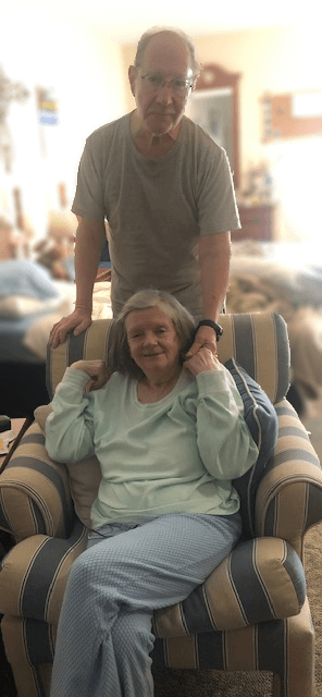 elderly couple posing together