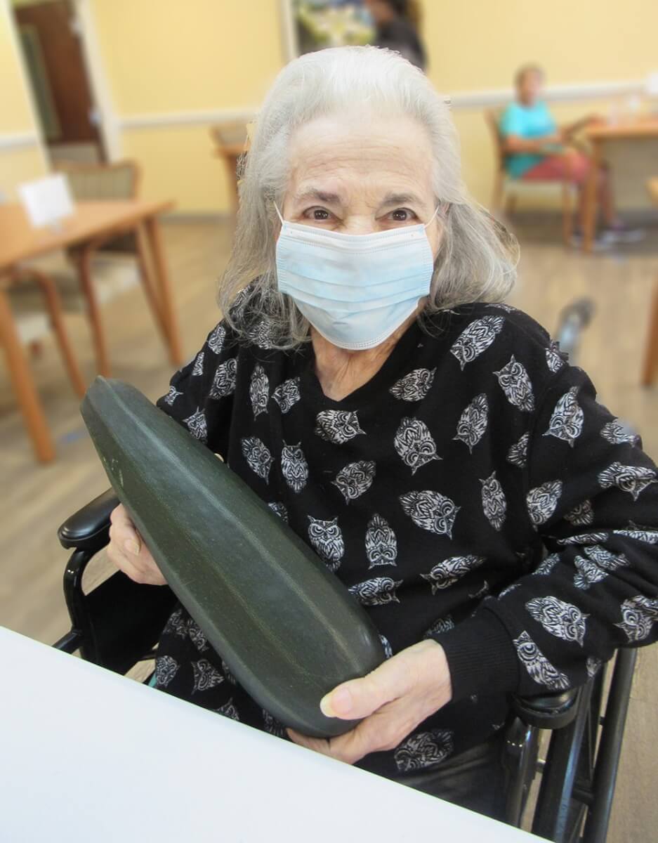 Aida Martinez holds a zucchini 