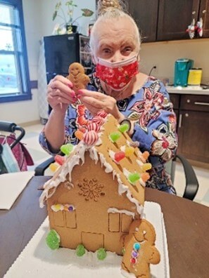 Resident with ginger bread house