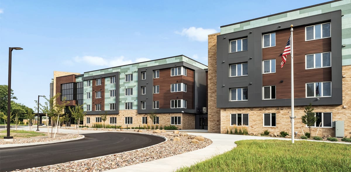 Building exterior with green grass and blue sky