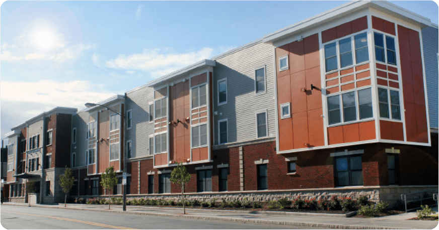 Orange and tan building with blue sky.